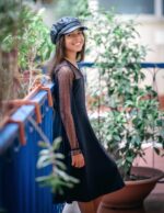 Suggest a better title and return a single title only without any other comments: Arshiner Girl's Contrast Mesh Puff Long Sleeve High Waist A Line Short Dress with Pockets for 6-13 Years - Image 5