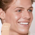 Suggest a better title and return a single title only without any other comments: Saie Slip Tint Tinted Moisturizer with SPF 35 - Light Coverage, Glowy Skin Tint & Mineral Sunscreen for Face with Hydrating Hyaluronic Acid - Summer Makeup Essential - Shade Three (1.35 oz) - Image 3